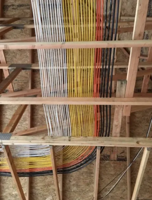 Cable runs pulled through open framing