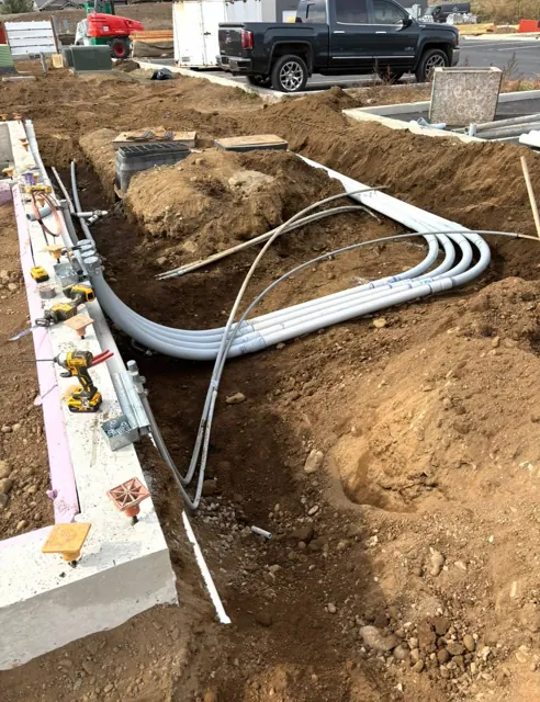 Underground conduit laid before backfill